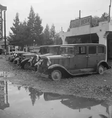 Roadside used car display on State Highway 17, Santa Clara County, California, 1939. Creator: Dorothea Lange
