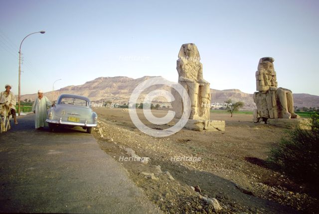 Roadside view of the Colossi of Memnon, Luxor Thebes), Egypt. Creator: Tony Evans.