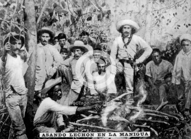 Roasting pig in the jungle, Cuba, (c1910). Artist: Unknown