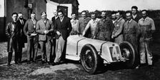 Robert Benoist with a cigarette, leaning against a Delage 15-S8, 1927