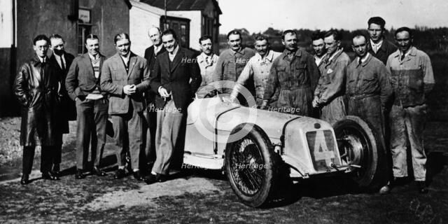 Robert Benoist with a cigarette, leaning against a Delage 15-S8, 1927. Artist: Unknown