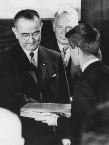 Robert F Kennedy accepts his brother's award from President Lyndon Johnson, December 1963. Creator: Unknown