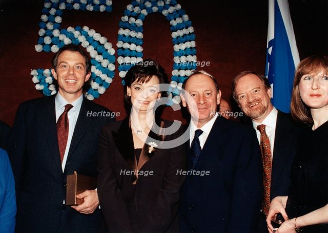 Robin Cook (1946- ), Tony Blair (1953- ) and Cherie Blair at a ceremony, 1998. Creator: Sidney Harris.