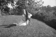 Robins, Miss, with dog, outdoors, 1918 Feb. 16. Creator: Arnold Genthe