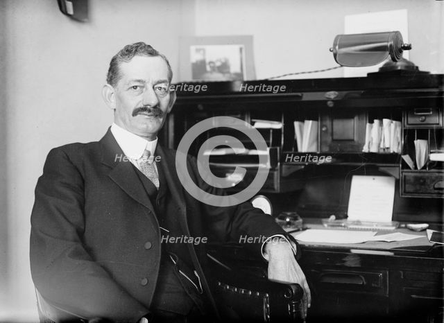Robt. N. Page seated at desk, 1916. Creator: Bain News Service.