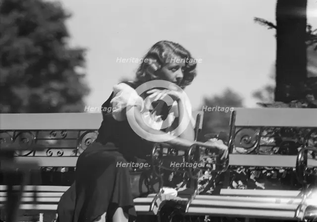 Roelof, Wilma, Miss, seated outdoors, 1932 July. Creator: Arnold Genthe.