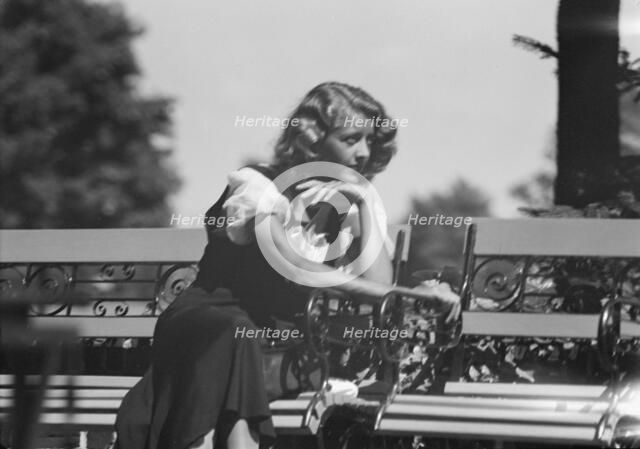 Roelof, Wilma, Miss, seated outdoors, 1932 July. Creator: Arnold Genthe.
