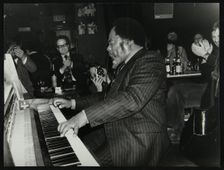 Roland Hanna playing the piano before an appreciative audience, 1980. Creator: Denis Williams