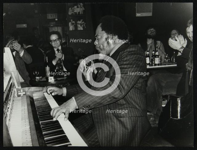 Roland Hanna playing the piano before an appreciative audience, 1980. Creator: Denis Williams.