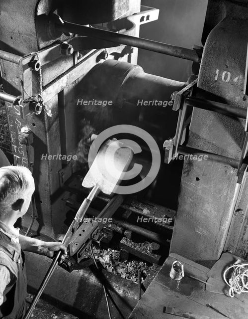 Rolling hot spades, garden tool manufacture, Sheffield, South Yorkshire, 1966. Creator: Michael Walters.
