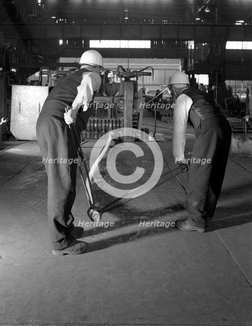 Rolling steel bars, Park Gate Iron & Steel Co, Rotherham, South Yorkshire, 1964. Creator: Michael Walters.