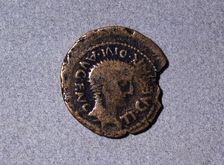 Roman coin from the first half of the first century AC, with a head facing right and the legend …