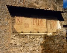 Roman graffiti on the wall, Road of Abundance, Pompeii, Italy, 2002. Creator: LTL