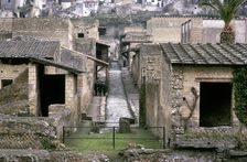 Roman huses of Herculaneum with the modern houses of Ercolano above, Italy