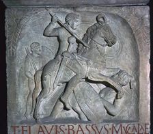 Roman relief of a Roman cavalry officer riding down a barbarian, 5th century