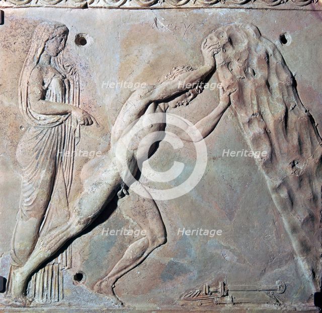 Roman terracotta Campana plaque showing Theseus lifting a huge rock. Artist: Unknown