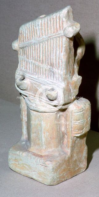 Roman terracotta lamp in the shape of a water-organ. Artist: Unknown