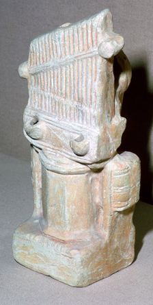 Roman terracotta lamp in the shape of a water-organ