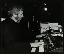 Ron Lohn playing the electronic organ at The Bell, Codicote, Hertfordshire, 22 February 1981. Creator: Denis Williams
