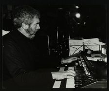 Ron Lohn playing the electronic organ at The Bell, Codicote, Hertfordshire, 22 February 1981. Creator: Denis Williams