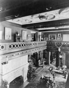Room with balcony, paintings, fireplace, grandfather clock, and elk..., Greenwich, Connecticut, 1908 Creator: Frances Benjamin Johnston