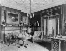 Room with plasterwork ceiling, fireplace, and circular table.., Greenwich, Connecticut, 1908. Creator: Frances Benjamin Johnston