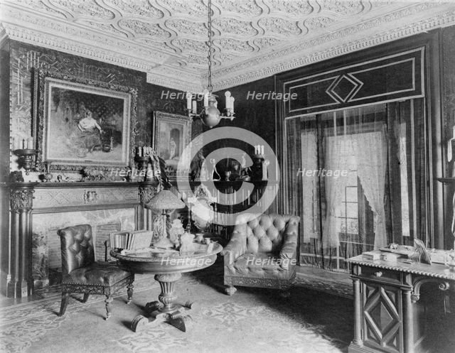 Room with plasterwork ceiling, fireplace, and circular table.., Greenwich, Connecticut, 1908. Creator: Frances Benjamin Johnston.