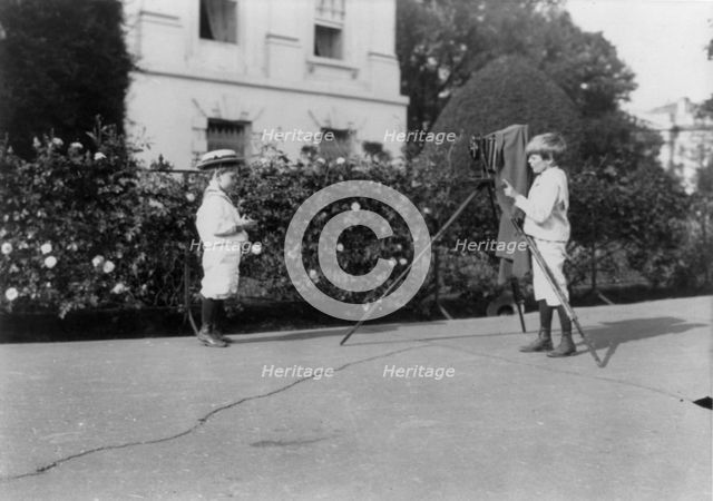 Roosevelt children - Archie photographing Quentin, 1902. Creator: Frances Benjamin Johnston.