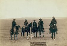 Roping gray wolf, Cowboys take in a gray wolf on "Round up," in Wyoming, 1887. Creator: John C. H. Grabill