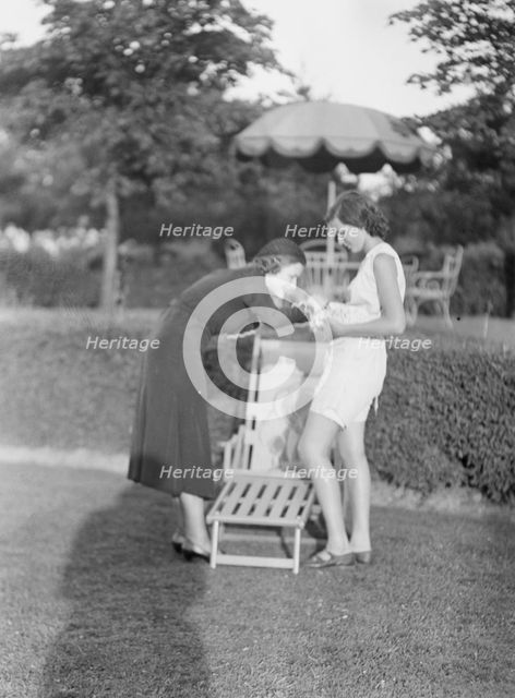 Rossbach, Miss, holding puppies, with another woman, 1932 June 30. Creator: Arnold Genthe.