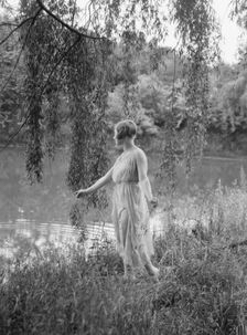 Rossin, F., Miss, standing outdoors, 1928 Creator: Arnold Genthe