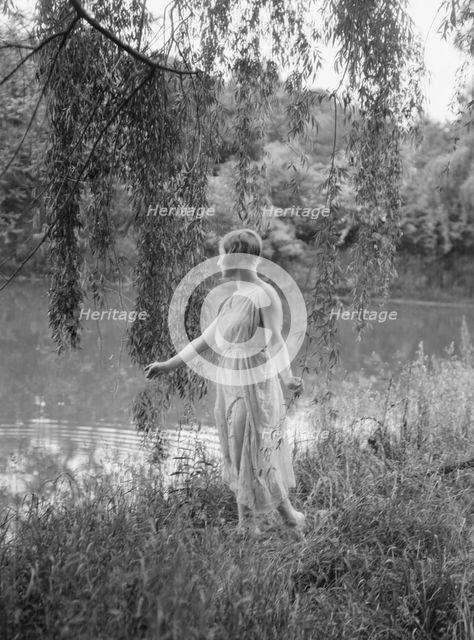 Rossin, F., Miss, standing outdoors, 1928 Creator: Arnold Genthe.
