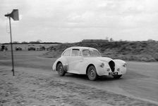 Ray Playford driving a Healey Elliott, at Snetterton Circuit, Norfolk, 1953. Creator: Unknown