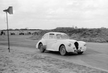 Ray Playford driving a Healey Elliott, at Snetterton Circuit, Norfolk, 1953. Creator: Unknown