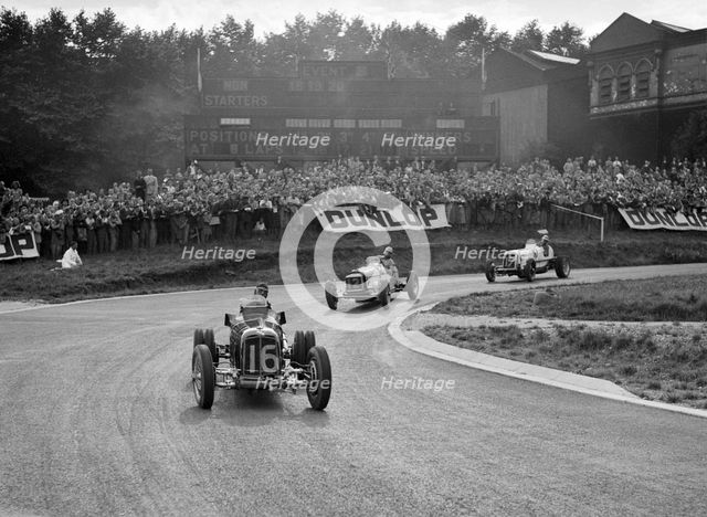 Raymond Mays' ERA leading an MG and another ERA, Imperial Trophy, Crystal Palace, 1939. Artist: Bill Brunell.