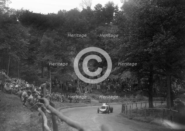 Raymond Mays' Vauxhall-Villiers competing in the Shelsley Walsh Speed Hill Climb, Worcestershire. Artist: Bill Brunell.