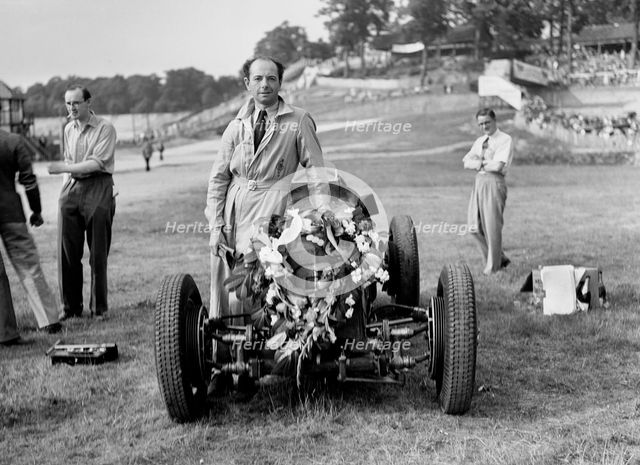 Raymond Mays with his ERA at Brooklands, Surrey, 1936. Artist: Bill Brunell.