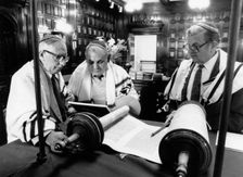 Rabbis looking at scrolls. Creator: Unknown