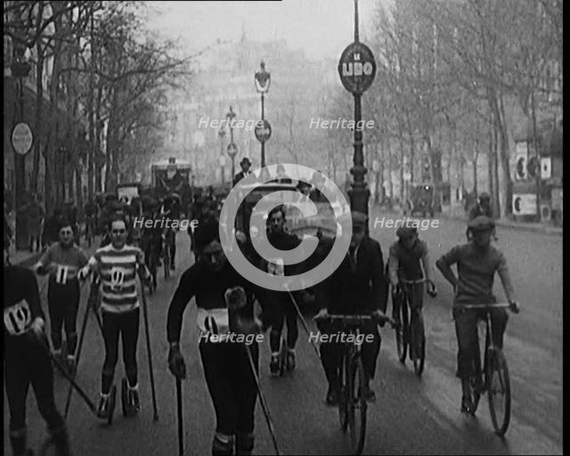 Racers Skiing Through Paris, France on Wheeled Skis, 1929. Creator: British Pathe Ltd.