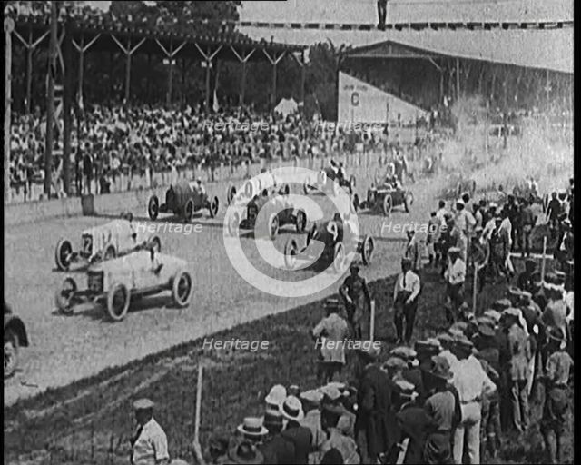 Racing Cars at the Start of a Race in Front of a Large Crowd, 1920. Creator: British Pathe Ltd.