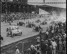 Racing Cars at the Start of a Race in Front of a Large Crowd, 1920. Creator: British Pathe Ltd