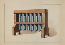 Rack with Candle Molds, c. 1935. Creator: Charles Caseau