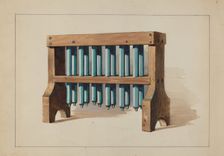 Rack with Candle Molds, c. 1935. Creator: Charles Caseau