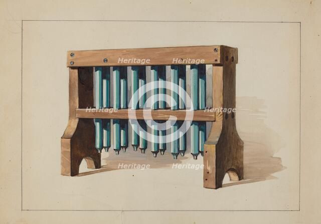 Rack with Candle Molds, c. 1935. Creator: Charles Caseau.