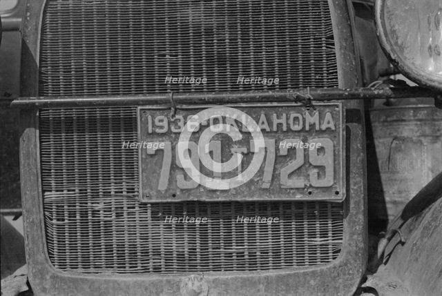 Radiator and license of Oklahoma cotton picker's car, San Joaquin Valley, California, 1936. Creator: Dorothea Lange.