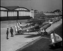 RAF Biplanes Taxiing Across a Field at tended to by Their Aircrews, 1933. Creator: British Pathe Ltd