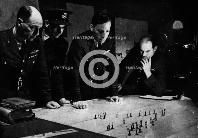 RAF Bomber Command operations room during a raid, 1941. Artist: Unknown.