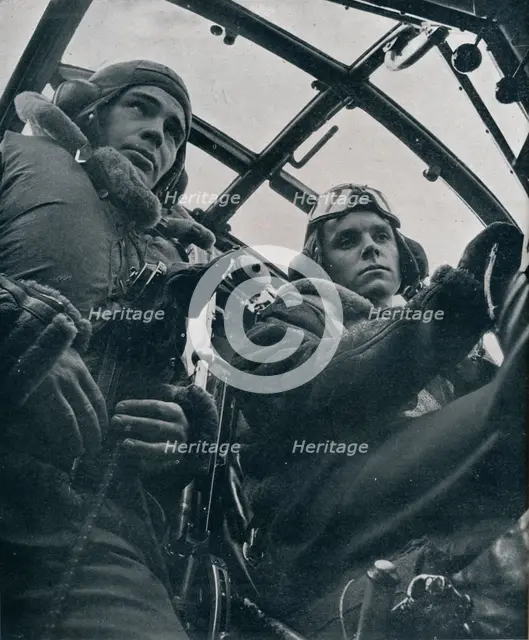 RAF bomber pilot and second pilot, 1941. Artist: Unknown.