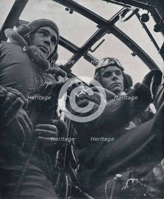 RAF bomber pilot and second pilot, 1941. Artist: Unknown.