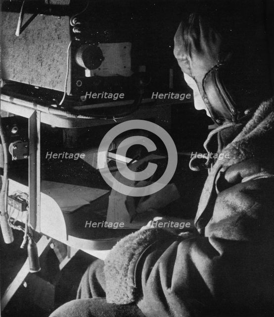 RAF Coastal Command radio operator on board his aircraft, c1940 (1943). Artist: Unknown.